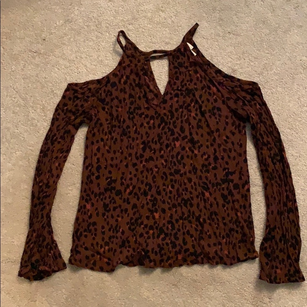 Open shoulder long sleeve shirt.